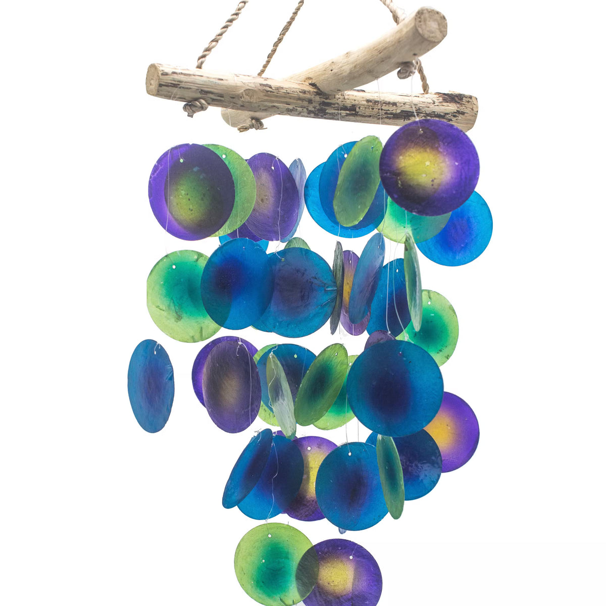 Handcrafted green purple and blue capiz shell wind chime with natural driftwood cross bar on white background