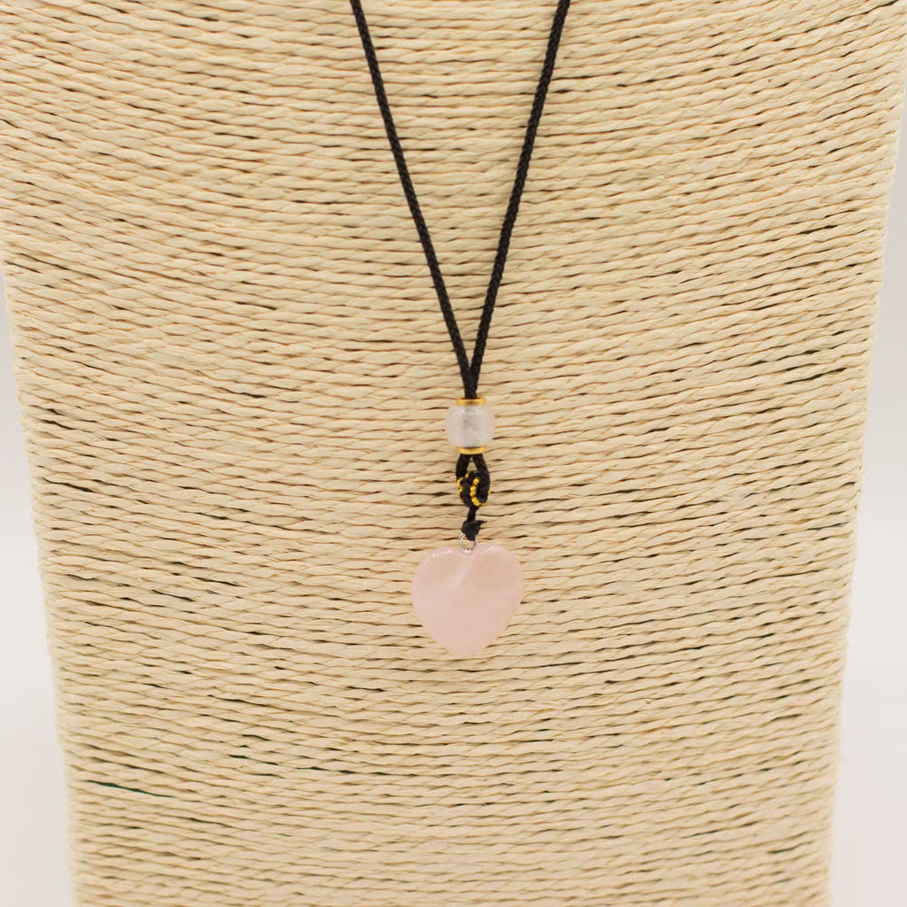 Rose quartz heart pendant necklace close up, natural gemstone jewellery