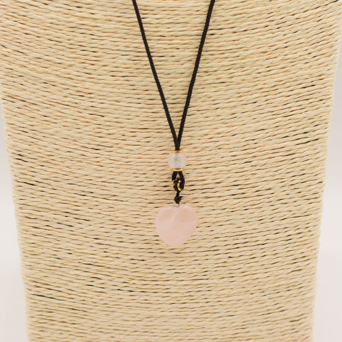 Rose quartz heart pendant necklace close up, natural gemstone jewellery