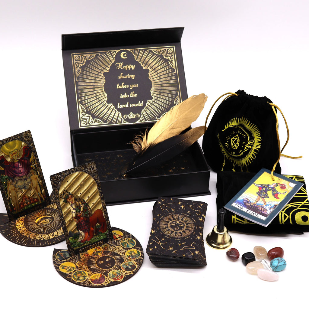 Gold foil tarot set contents including cards velvet pouch crystals feather bell and tarot cloth gift set UK