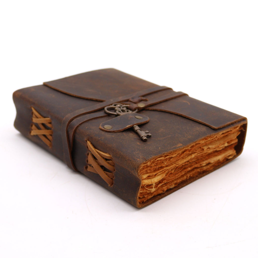 Leather bound journal with key close up handcrafted vintage style notebook