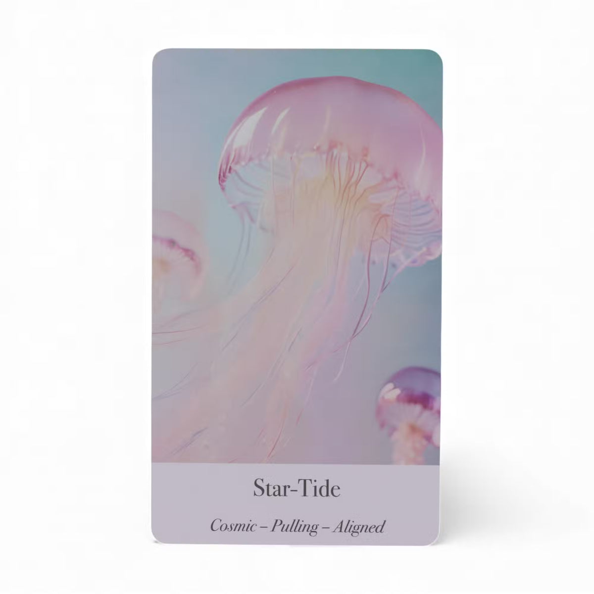 Star-Tide oracle card featuring pink jellyfish floating in blue ocean — Cosmic Pulling Aligned