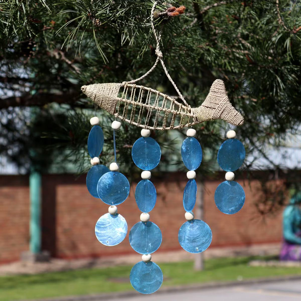 Woven jute string fish coastal wall hanging with blue shell disc drops and white wooden beads